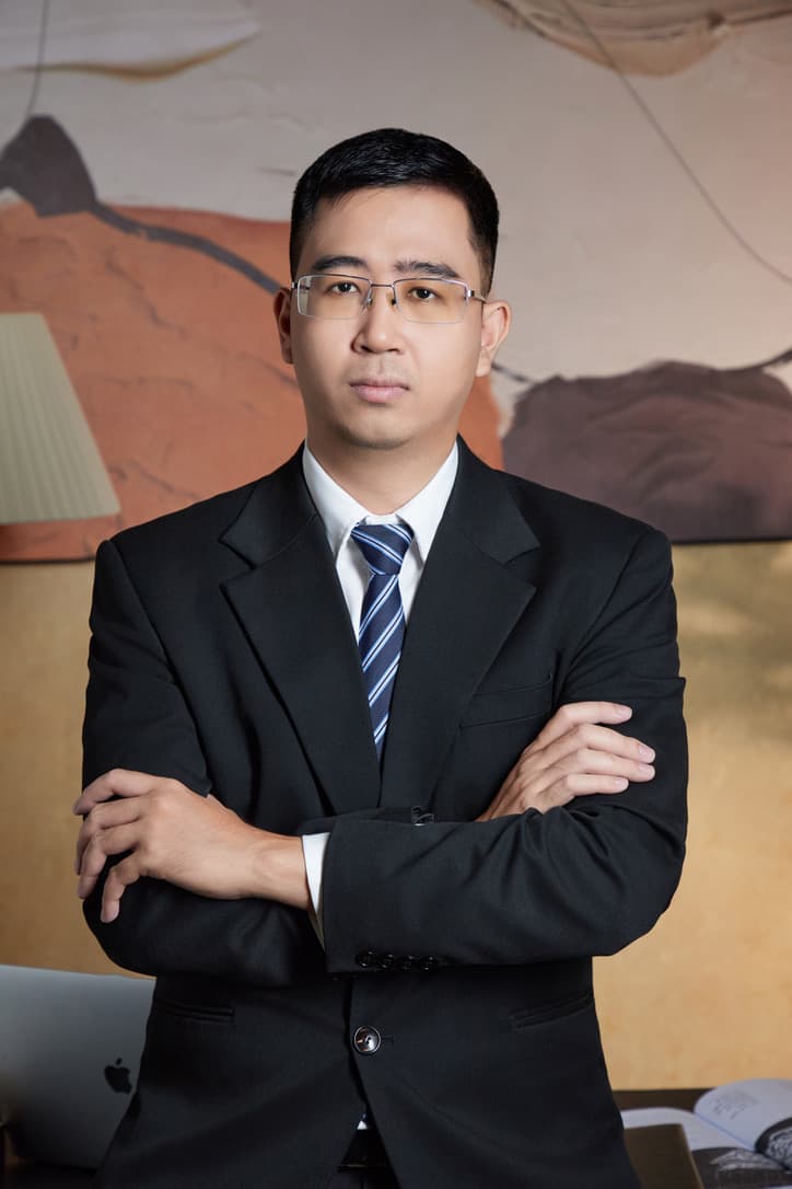 Tri Nguyen in a professional portrait